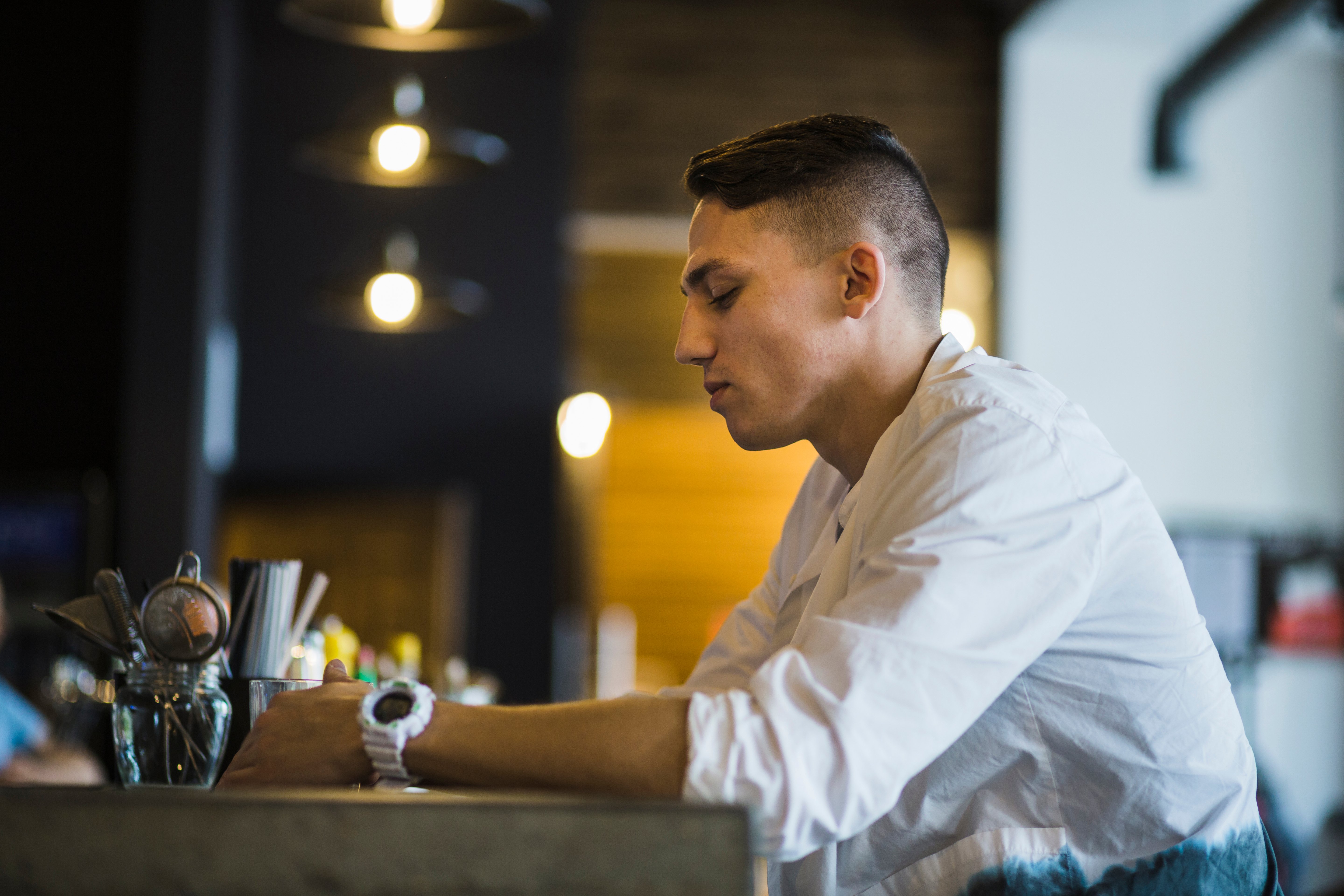 side-view-man-holding-glass-drink-restaurant
